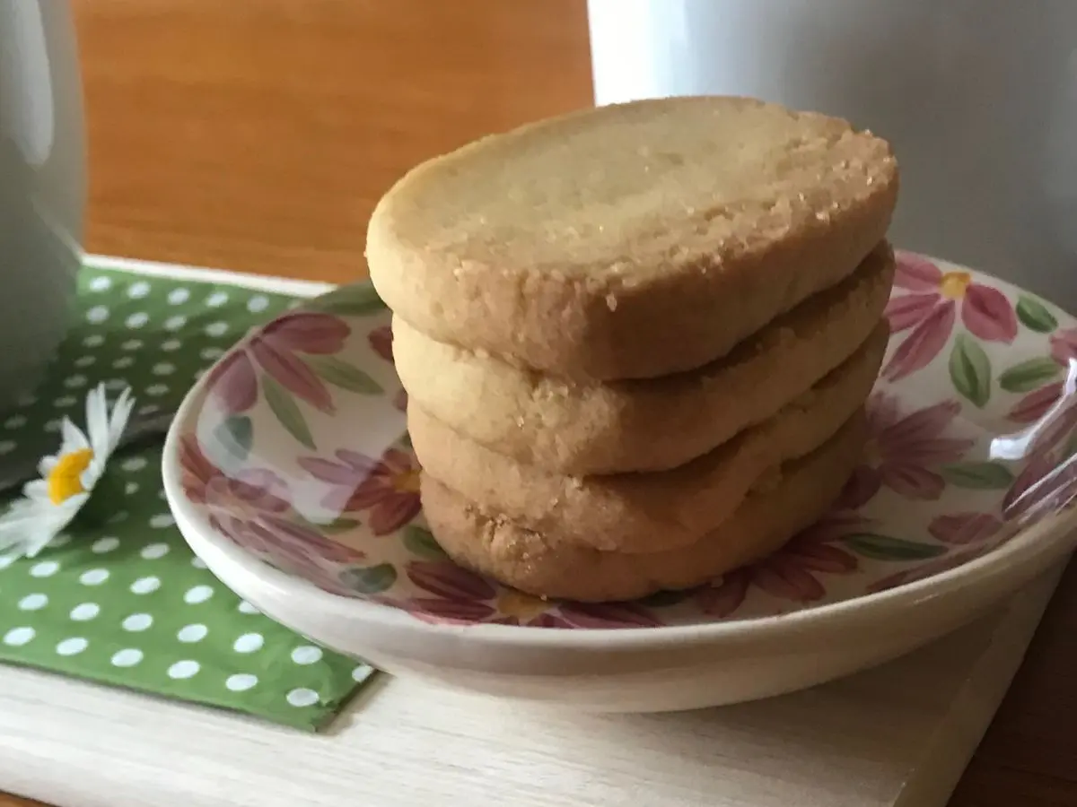 Finished Heidesand (German browned butter cookies) stacked on a plate